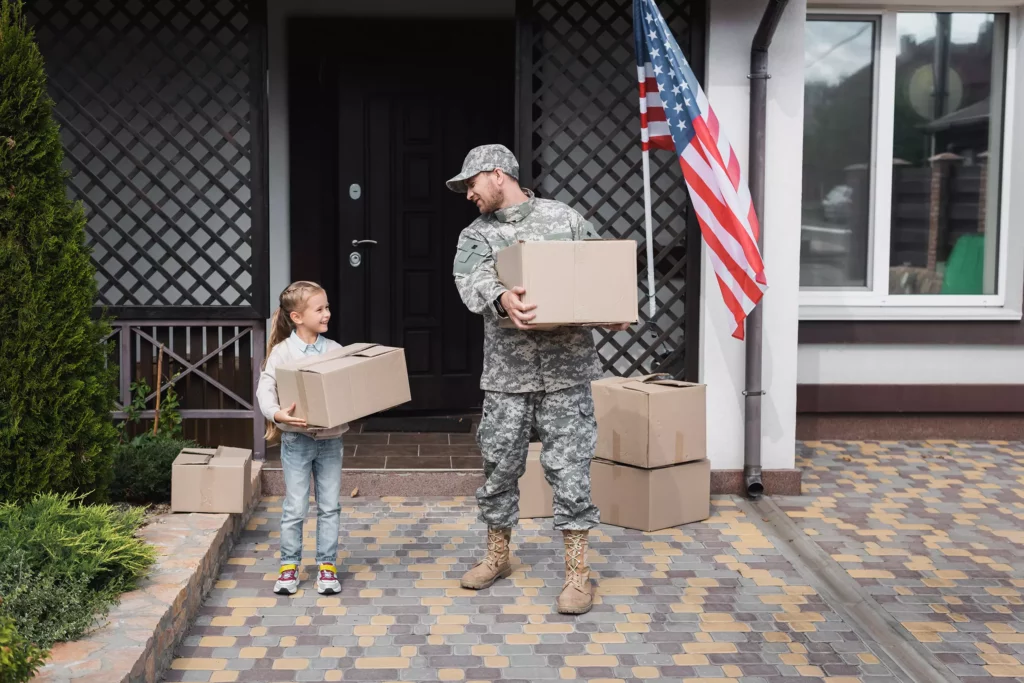 Hercules Moving Solutions - Military Moving - Father and Daughter carrying boxes